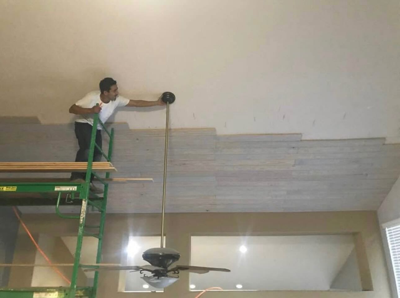 Installing tongue and groove ceiling from scaffolding