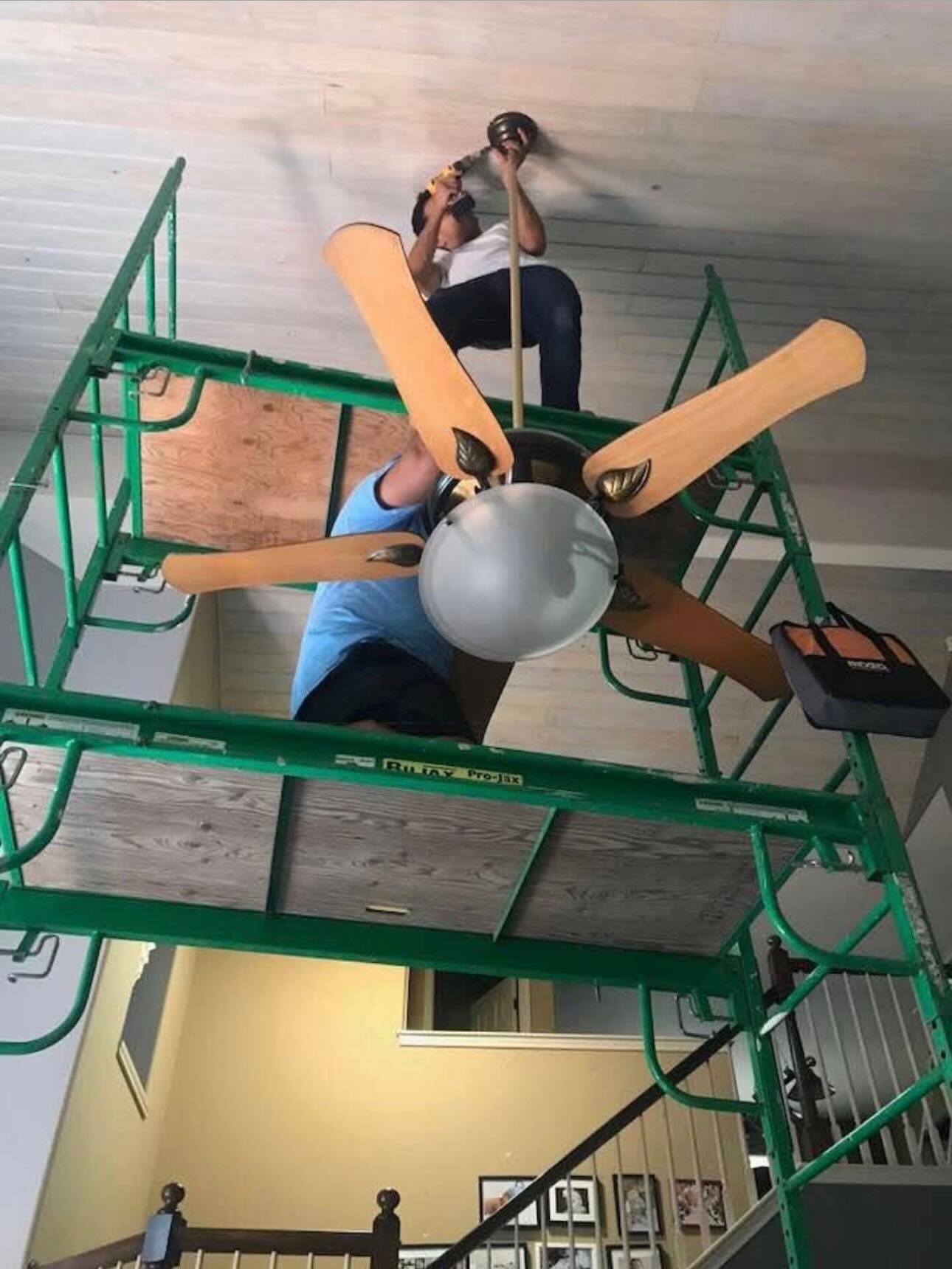 Team working on high ceiling installation